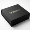 Premium custom packaging — luxury matte black gift box with gold foil branding